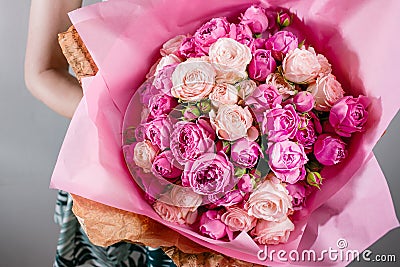 Luxury bouquets of flowers Pink Colour peonies and roses in the hands women. Stock Photo