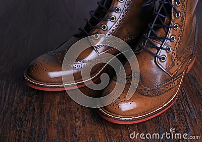 Luxury brown shoes on wood background. Stock Photo