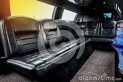 Luxury car interior limousine with black leather seats and a small bar inside the interior of the car Stock Photo