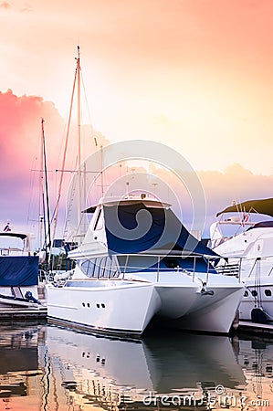 Luxury catamaran yacht dock at the marina with other boats in th Editorial Stock Photo