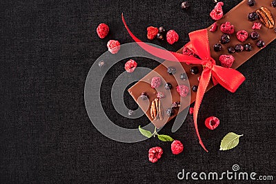 Chocolate bar with freeze-dried berries. Stock Photo