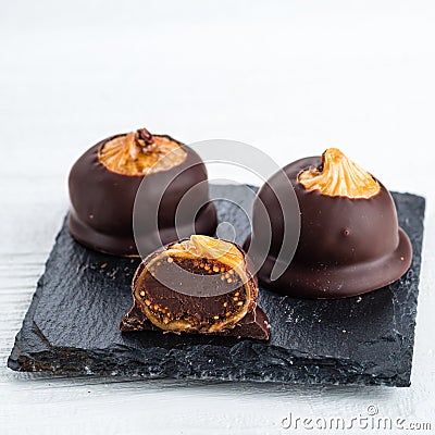 luxury chocolate dried figs in chocolate natural sweets Stock Photo