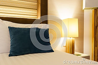 Luxury bedroom with lamp and green pillow Stock Photo