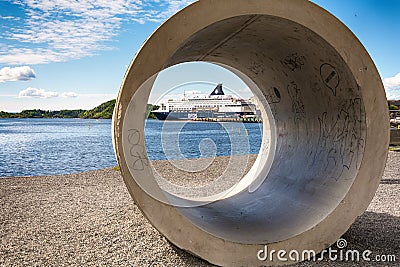 Luxury cruise liner moored in the tranquil waters of Oslo habour beside the historic Akershus Fortress, Norway. Editorial Stock Photo