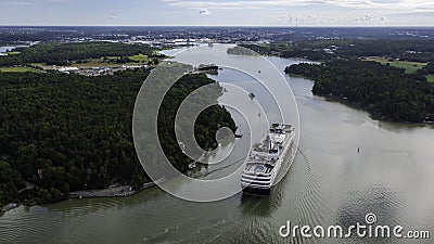 Luxury cruise vessel making way ahead in narrow Finnish archipelago Stock Photo