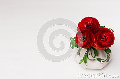 Luxury deep red three flowers in ceramic vase on white wood background. Romantic decor. Stock Photo