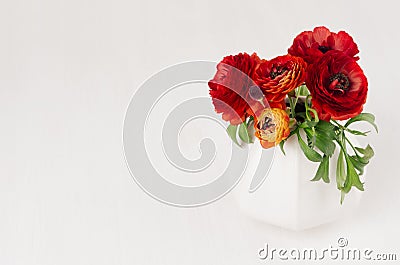 Luxury deep red three flowers in ceramic vase on white wood background. Romantic decor for holidays event. Stock Photo