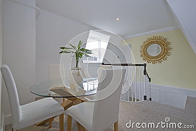 Luxury dining room with round glass table Stock Photo