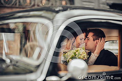 Luxury elegant wedding couple kissing and embracing in stylish b Stock Photo