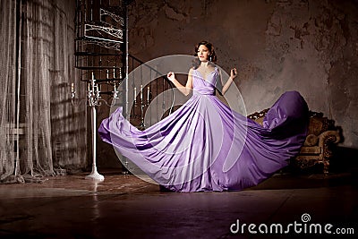 Luxury fashion stylish woman in the rich interior. Beautiful girl with a fashionable hairstyle and makeup chic Stock Photo