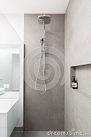 Luxury fully tiled shower with rain head and hand held shower Stock Photo