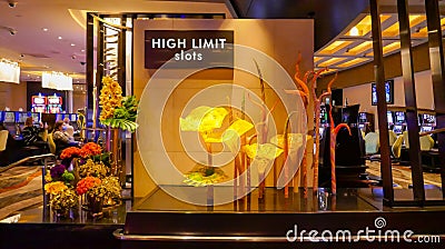 Artistic glass flower installation beside the High Limit Slots sign in a Vegas casino Editorial Stock Photo