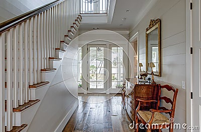 Luxury home entry foyer with view out onto waterfront property Stock Photo