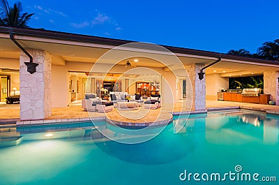 Luxury Home with Pool at Sunset Stock Photo