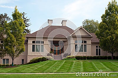 Luxury Home with Two Fireplace Chimneys Stock Photo