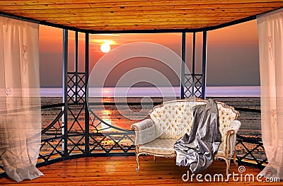 Luxury hotel balcony room with sunset ocean window view Stock Photo