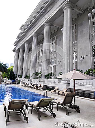Luxury hotel pool, loungers Stock Photo