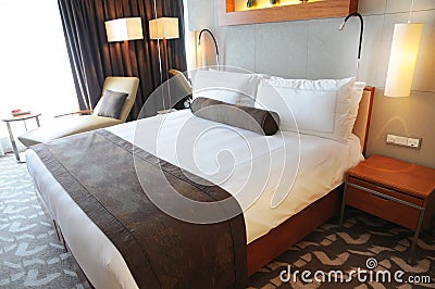 Luxury hotel room with king size bed Stock Photo
