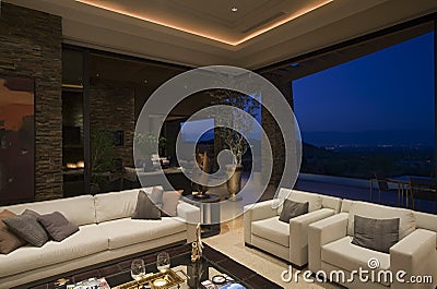 Luxury Living Room In House At Night Stock Photo