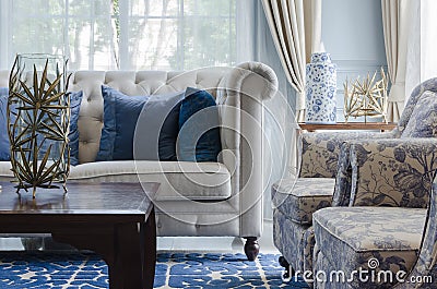 Luxury living room with sofa on blue pattern carpet at home Stock Photo