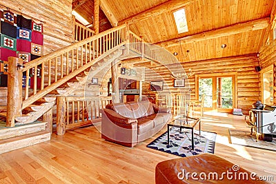 Luxury log cabin living room with leather sofa. Stock Photo