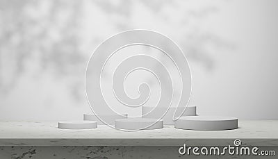 Luxury marble table with plant shadow on white wall and cylinder stand arrangement for product placement display. Modern minimal Stock Photo