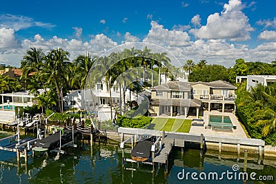 Luxury Miami Beach waterfront house with boat and palm trees Stock Photo