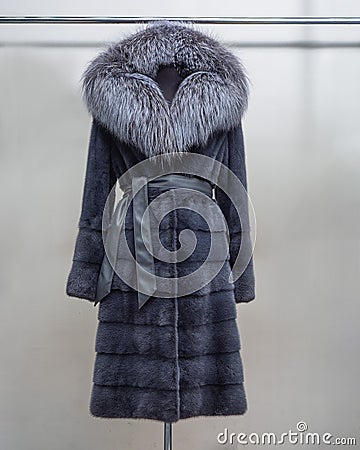 Luxury mink fur coat with collar black Fox gray with belt Stock Photo