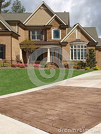 Luxury Model Home Exterior stone driveway Stock Photo