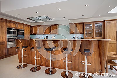 Luxury modern kitchen with breakfast bar and stools Editorial Stock Photo