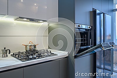 Luxury modern kitchen interior, oven`s door opened Stock Photo