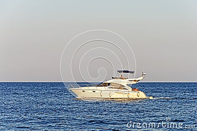 Luxury motor yacht under way out at sea Editorial Stock Photo