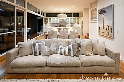 Luxury open plan lounge room in a domestic home with soft furnishings, art and decorations Editorial Stock Photo