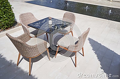 Luxury outdoor wicker furniture with marble table Stock Photo