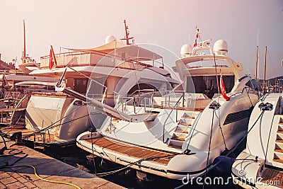Luxury parked modern motor yacht marina dock in sea Stock Photo