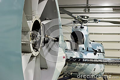 Luxury private helicopter parked in the hangar. Stock Photo