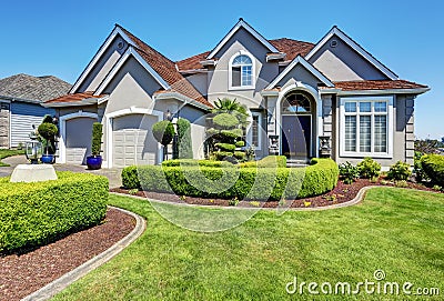 Luxury residential house with perfectly kept front garden. Stock Photo