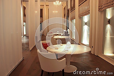 Luxury restaurant in Cheval Blanc Maldives, rounded table and chairs Editorial Stock Photo