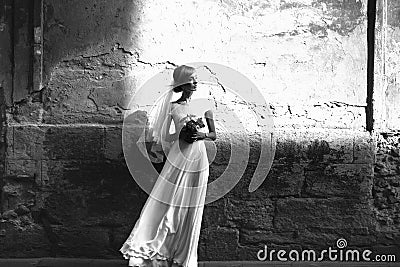 Luxury romantic gorgeous holding hands bride on the background o Stock Photo