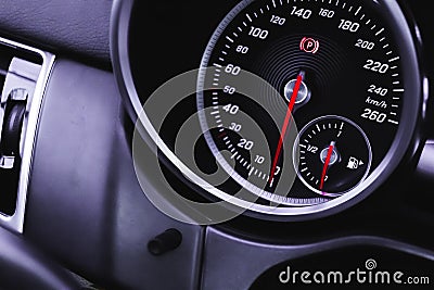 Luxury speedometer in sport car close-up view wallpaper, glowing red indicators Stock Photo