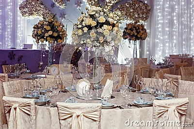 Luxury wedding decor with flowers and glass vases and number of Stock Photo