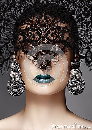 Luxury Woman with Celebrate Fashion Makeup, silver Earrings, black Lace veil. Halloween or Christmas style. Lips Make-up Stock Photo