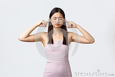 Luxury women, party and holidays concept. Bothered and distressed young elegant woman in evening dress, frowning with Stock Photo