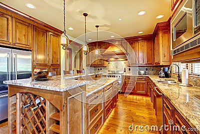 Luxury wood kitchen with granite countertop. Stock Photo