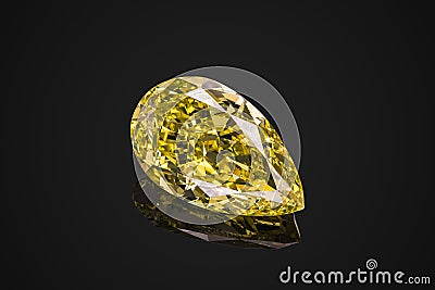 Luxury yellow transparent sparkling gemstone shape pear cut diamond isolated on black background Stock Photo