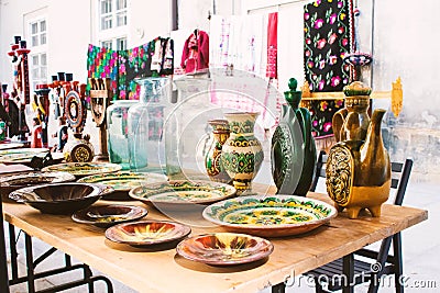 Lviv, Ukraine - August 09, 2020 : garage sale Tlum and Kram. Traditional ukrainian ceramic dinnerware - plates and jugs Editorial Stock Photo