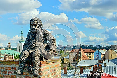 LVIV, UKRAINE - AUGUST 22 , 2017 , Awesome sculpture of the chimney sweep siting on the funnel on the roof of the House of Legends Editorial Stock Photo