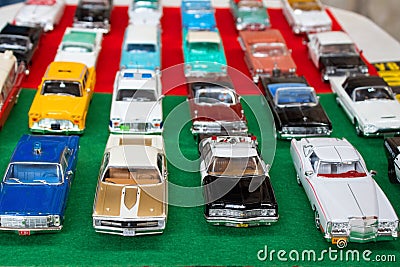 Lviv, Ukraine - March 7, 2021 - group of retro model toy cars - yellow New York taxi, vintage police car. Different Editorial Stock Photo