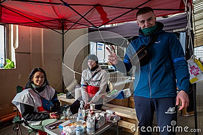 LVIV, UKRAINE -March 14, 2022: Humanitarian crisis during the war in Ukraine. Volunteer medics or paramedics who help thousands of Editorial Stock Photo