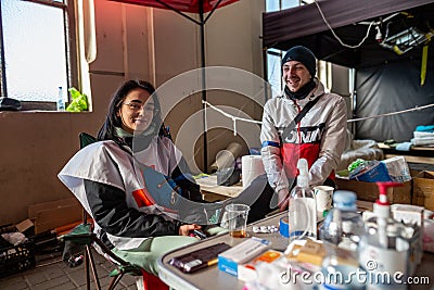 LVIV, UKRAINE -March 14, 2022: Humanitarian crisis during the war in Ukraine. Volunteer medics or paramedics who help thousands of Editorial Stock Photo